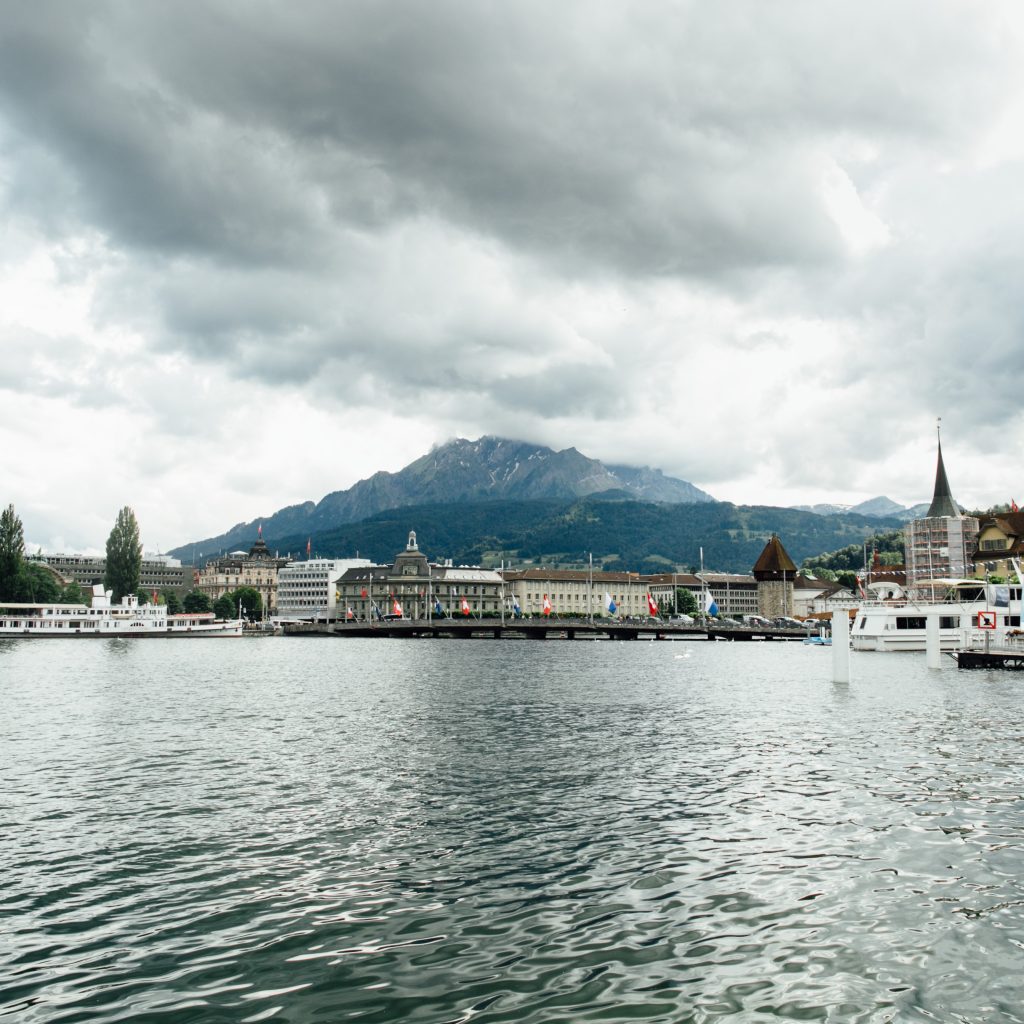 Travel in Switzerland. Beautiful view on lake in Lucerne, city and mountain. Tourism